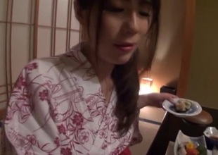 Pretty Japanese housewife engulfs cock and enjoys rear banging